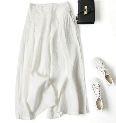 "Løse fritidsbukser til kvinder i premium syntetisk tekstil, åndbar med justerbar talje, afslappet pasform og ensfarvet desig