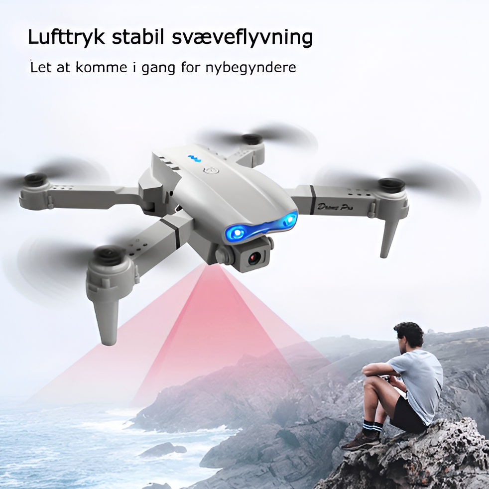 "4K UHD drone med dobbelte kameraer, lang flyvetid, grå design, perfekt til professionelle og hobbyfotografer."