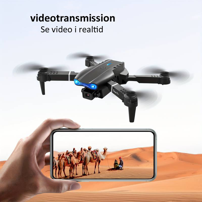 "4K UHD drone med dobbelte kameraer, lang flyvetid, grå design, perfekt til professionelle og hobbyfotografer."