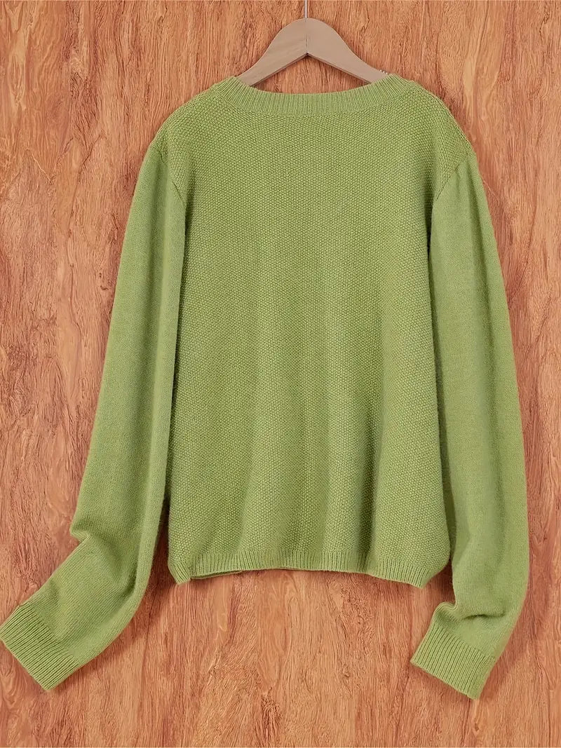 "Blød oversized uld strikcardigan til kvinder, elegant og komfortabel med afslappet pasform og praktiske lommer."