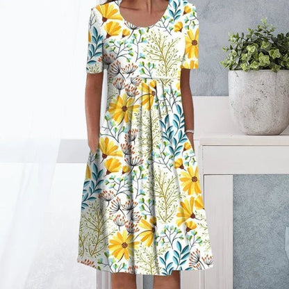 Blomstret maxi kjole i gul og lyseblå, elegant og afslappet stil, perfekt til både formelle og afslappede begivenheder.