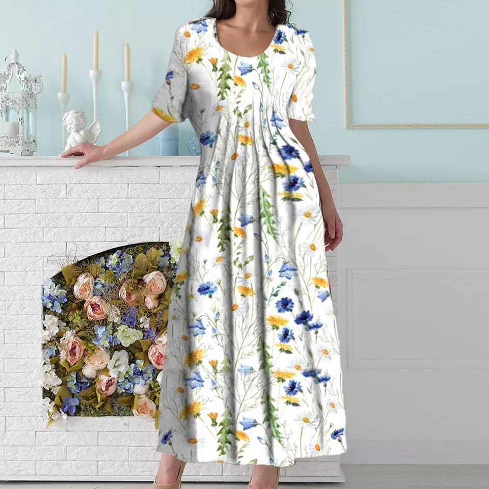 "Blomstret sommer midi kjole, let stof, afslappet pasform, lommer, feminint design, perfekt til varme dage"