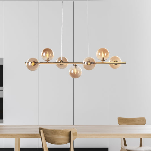 "Bubbles langbordspendel 90cm med ravfarvede glaskupler, messingstel, elegant design og justerbar højde for spisestue"
