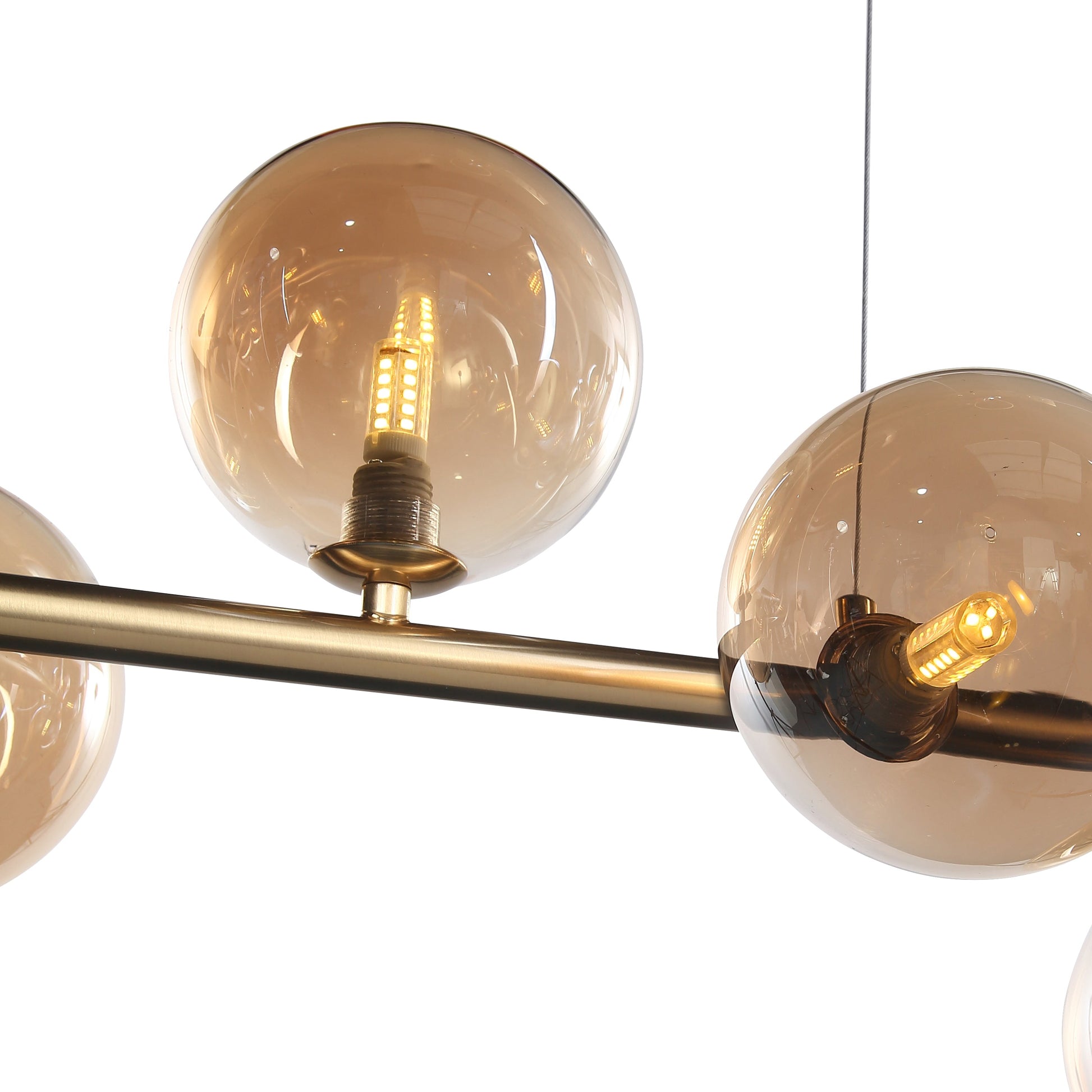 "Bubbles langbordspendel 90cm med ravfarvede glaskupler, messingstel, elegant design og justerbar højde for spisestue"