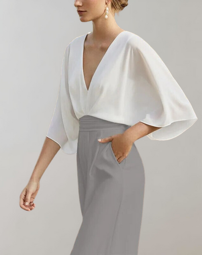 "Chik kvindejumpsuit i let stof med brede ben, elegant silhuet; perfekt til både hverdag og fest."