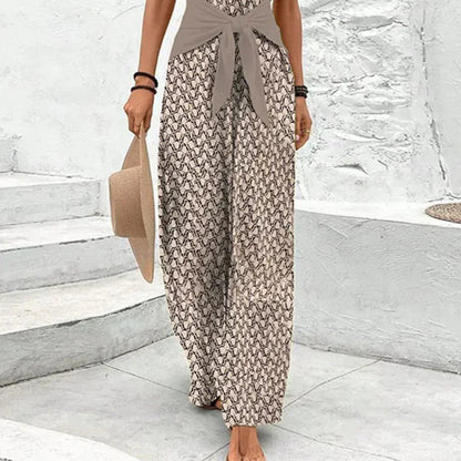 "Dame jumpsuit, ærmeløs V-hals, bred ben, bindebælte, geometrisk print, elegant og komfortabel til dag og aften."