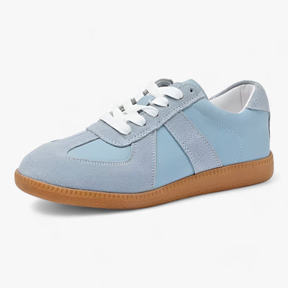 "Dame sneakers i ægte læder, stilfuldt design med klassisk look i hvid og sort, ideelle til daglig komfort og elegance."