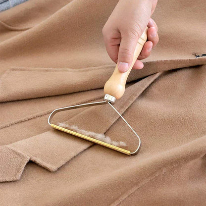 "Effektiv håndholdt fnugfjerner, kompakt design, miljøvenlig, fjerner fnug og dyrehår fra tøj, tæpper og sengetøj."