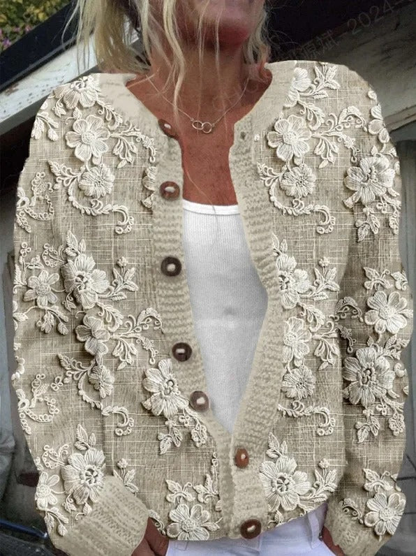 "Elegant blomstrede strikjakke til damer, front view, med farverige blomstermønstre, ideel til både arbejds- og fritidsbrug."