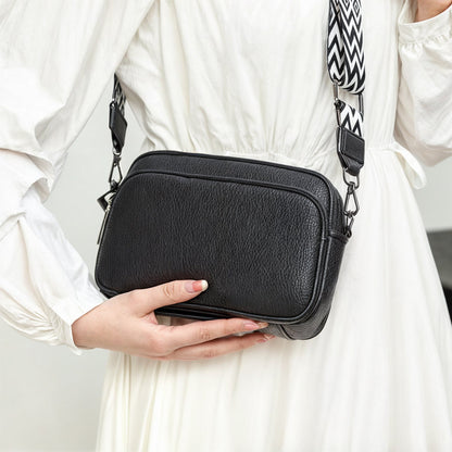 "Elegant crossbody-taske i ægte læder til kvinder; alsidigt design med justerbar rem og flere rum; passer til enhver stil."