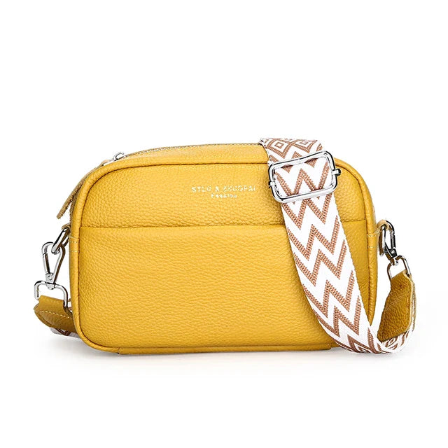 "Elegant crossbody-taske i ægte læder til kvinder; alsidigt design med justerbar rem og flere rum; passer til enhver stil."