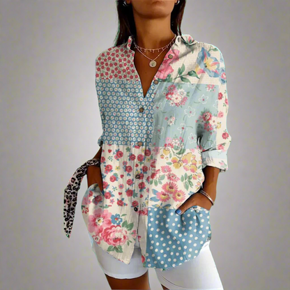 "Elegant kvindebluse i luksuriøst blødt materiale med håndlavede detaljer og klassisk design."