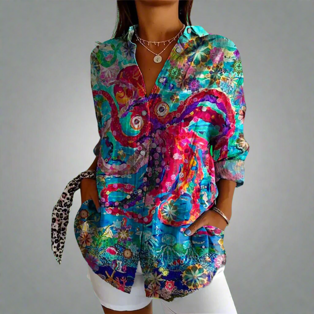 "Elegant kvindebluse i luksuriøst blødt materiale med håndlavede detaljer og klassisk design."