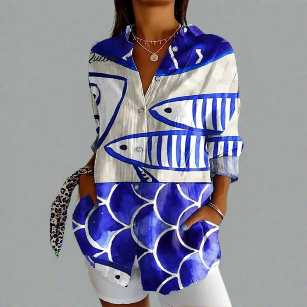 "Elegant kvindebluse i luksuriøst blødt materiale med håndlavede detaljer og klassisk design."