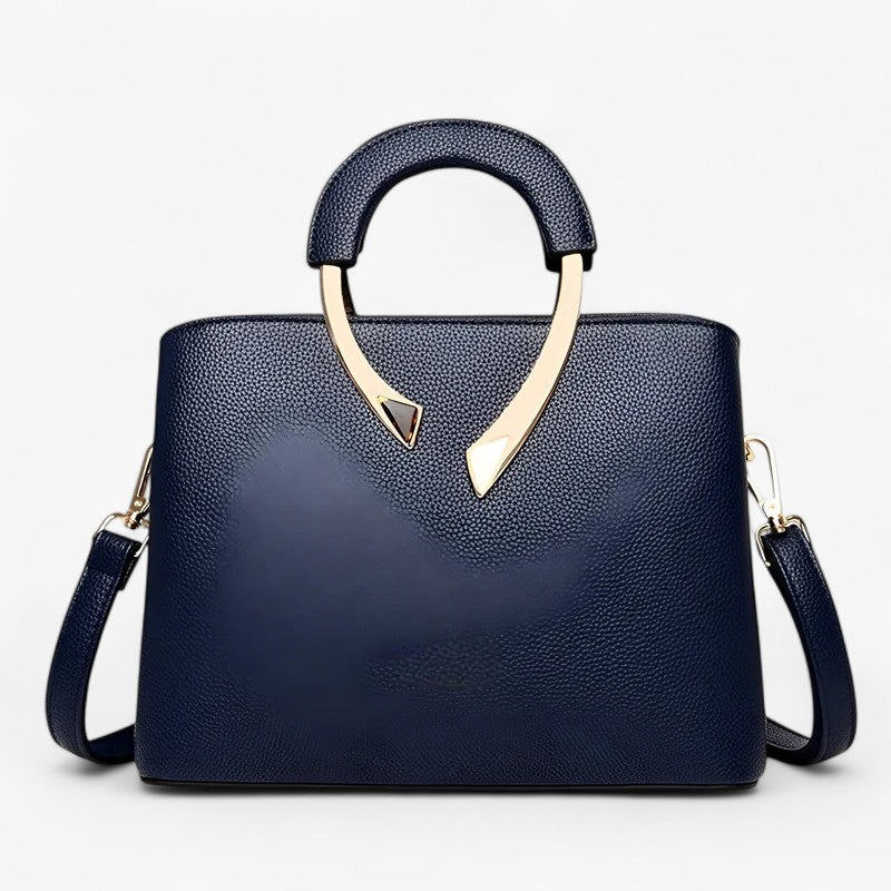 "Elegant læder tote til kvinder med rummelige lommer, tidsløst design og justerbar skulderrem for stil og komfort."