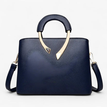 "Elegant læder tote til kvinder med rummelige lommer, tidsløst design og justerbar skulderrem for stil og komfort."