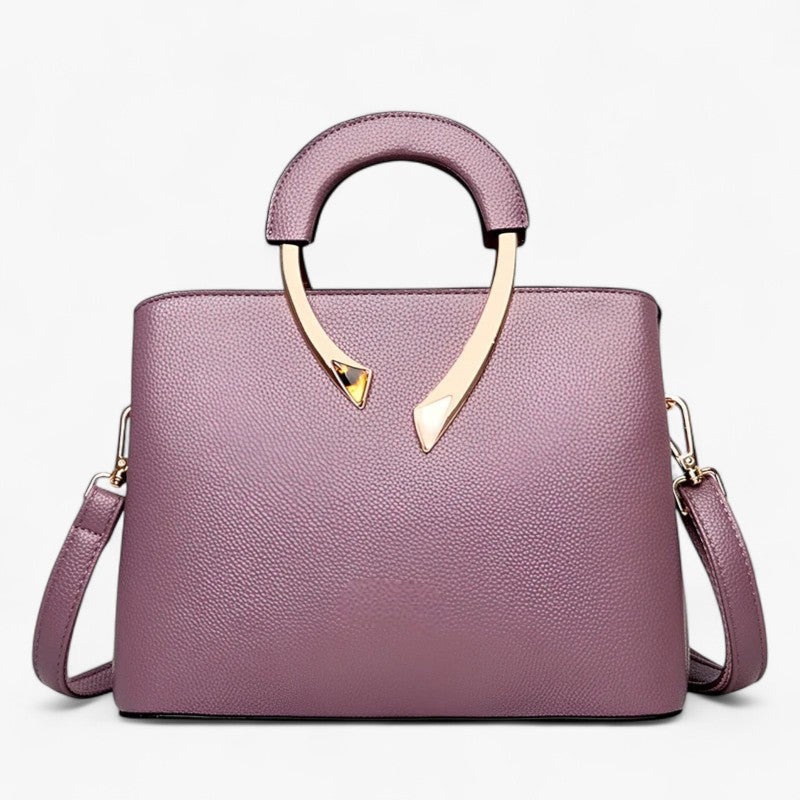 "Elegant læder tote til kvinder med rummelige lommer, tidsløst design og justerbar skulderrem for stil og komfort."