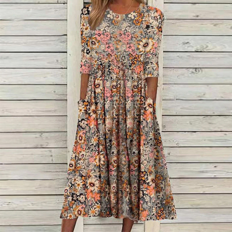 "Elegant Una midikjole i blødt stof, løs pasform, klassisk midilængde, perfekt til både hverdag og aftenbrug."