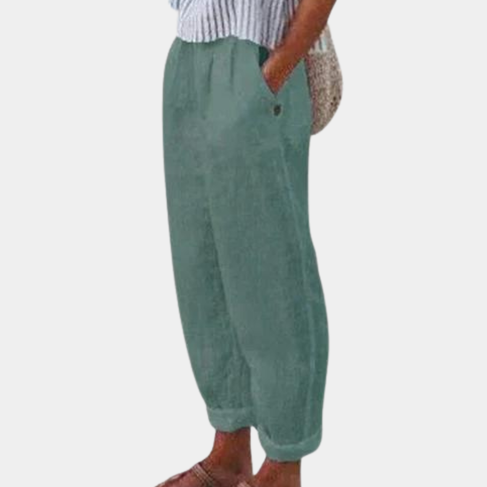 "Elegante forårsbukser til kvinder med høj talje, lige ben, elastisk linning og praktiske lommer, set forfra."