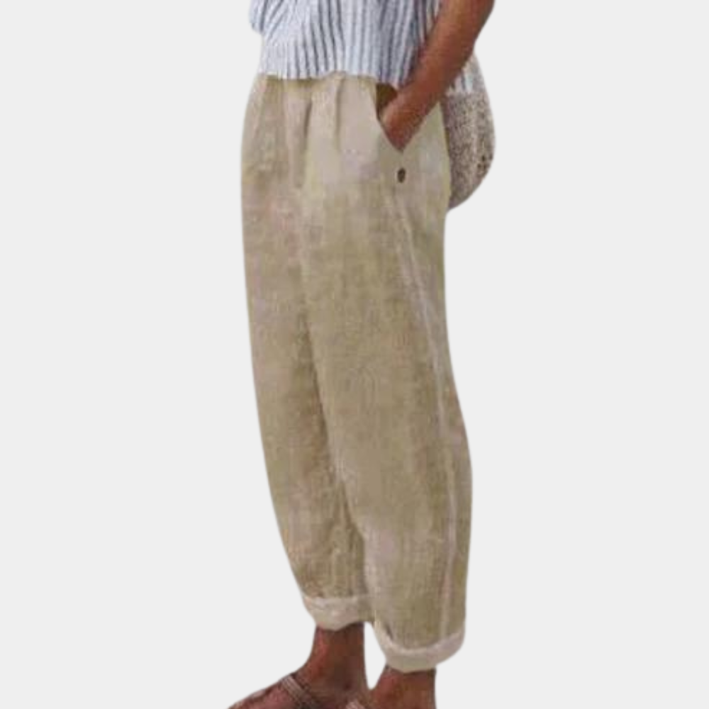 "Elegante forårsbukser til kvinder med høj talje, lige ben, elastisk linning og praktiske lommer, set forfra."