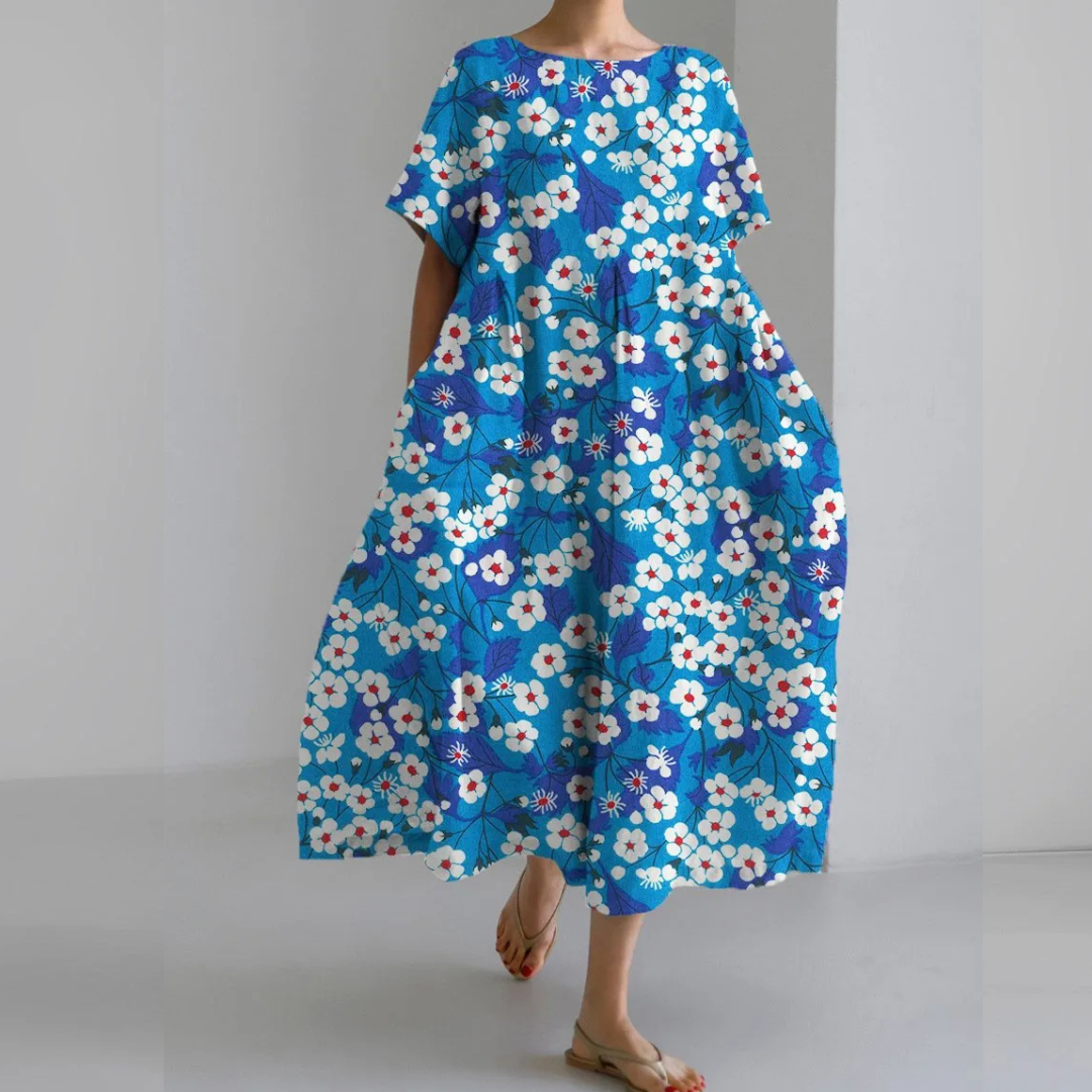 "Farverig blomsterkjole i pastelnuancer med flatterende silhuet, ideel til forårsbegivenheder og afslappet brug."