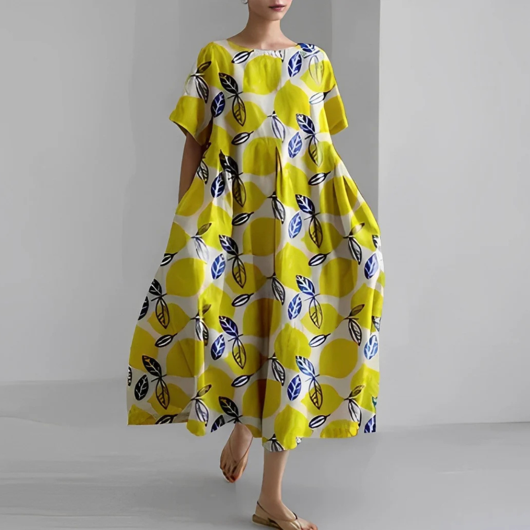 "Farverig blomsterkjole i pastelnuancer med flatterende silhuet, ideel til forårsbegivenheder og afslappet brug."