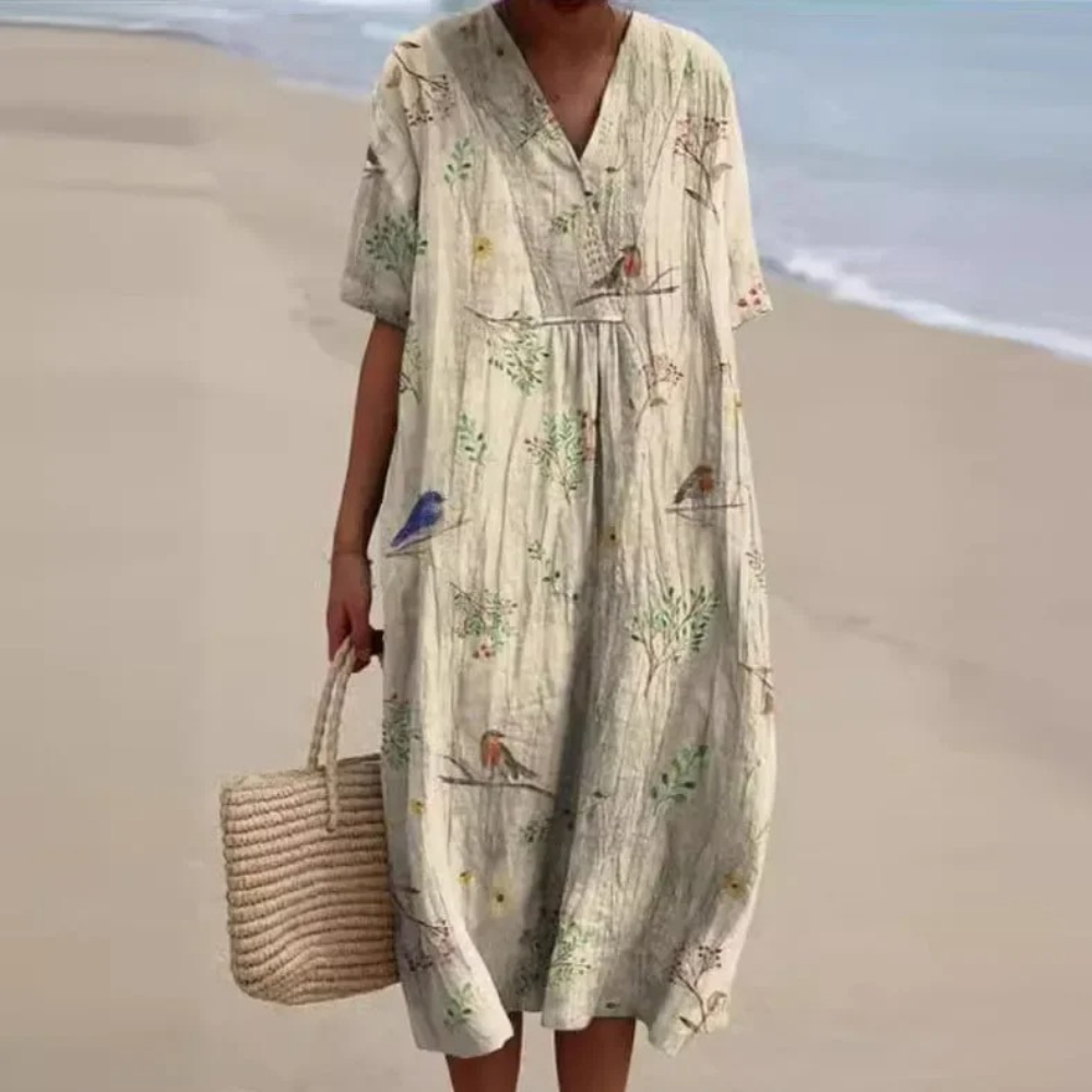 "Farverig forårskjole til kvinder med livligt blomstret print, ideel til elegante og afslappede lejligheder"