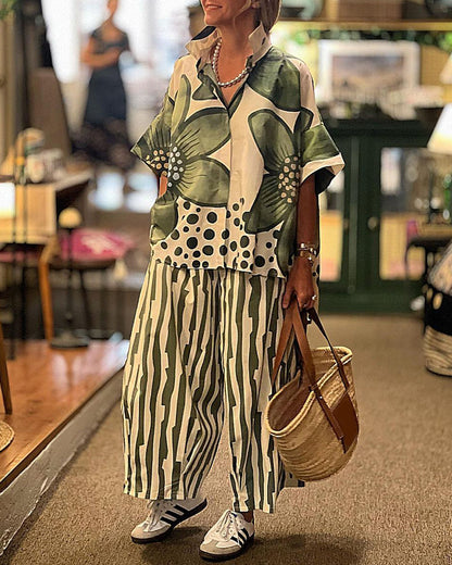 "Grøn skjorte med blomsterprint og stribede bukser for moderne kvinder"