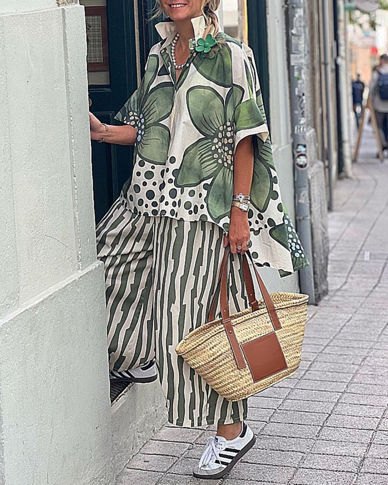 "Grøn skjorte med blomsterprint og stribede bukser for moderne kvinder"