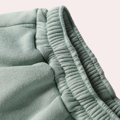 Grønt Keelin træningssæt til damer, stilfuldt joggingtøj med jakke og bukser, ideelt til både sport og afslapning.