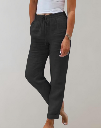 "Højtaljede brede-ben bukser til kvinder i blødt materiale, elegant pasform, lysegrå farve, ideel til både arbejde og fritid.