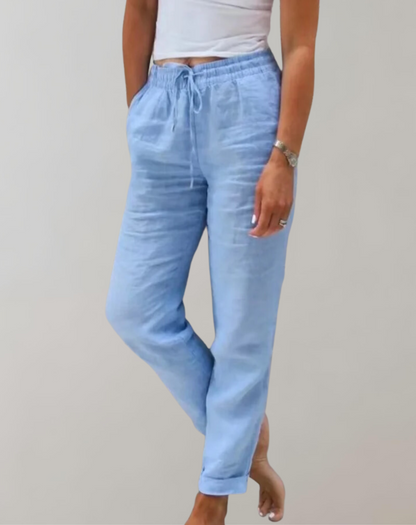 "Højtaljede brede-ben bukser til kvinder i blødt materiale, elegant pasform, lysegrå farve, ideel til både arbejde og fritid.