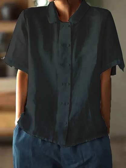 "Hvid løstsiddende bluse i bomuld og hør med korte ærmer, elegant og luftigt design for alsidig sommertøjstil."