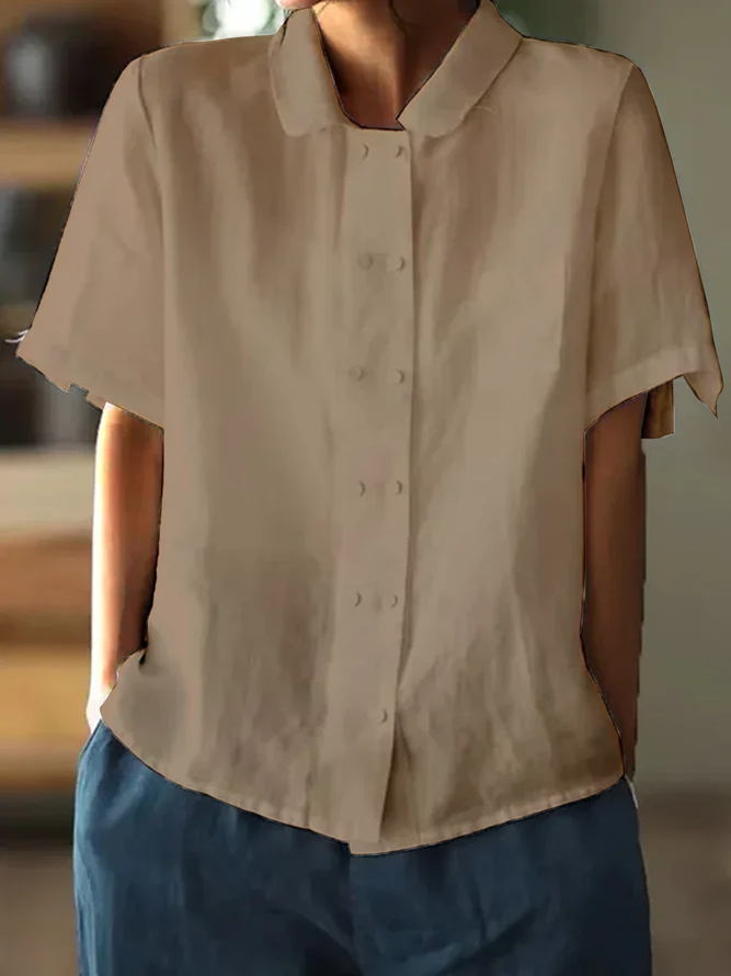 "Hvid løstsiddende bluse i bomuld og hør med korte ærmer, elegant og luftigt design for alsidig sommertøjstil."