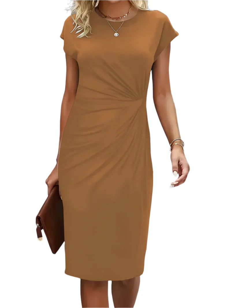 "Klassisk midi kjole i tidløst design, rund hals, feminin silhuet, let materiale, perfekt til hverdag og fest."