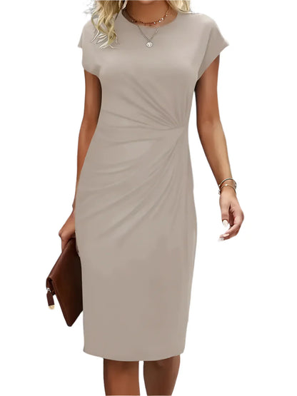 "Klassisk midi kjole i tidløst design, rund hals, feminin silhuet, let materiale, perfekt til hverdag og fest."