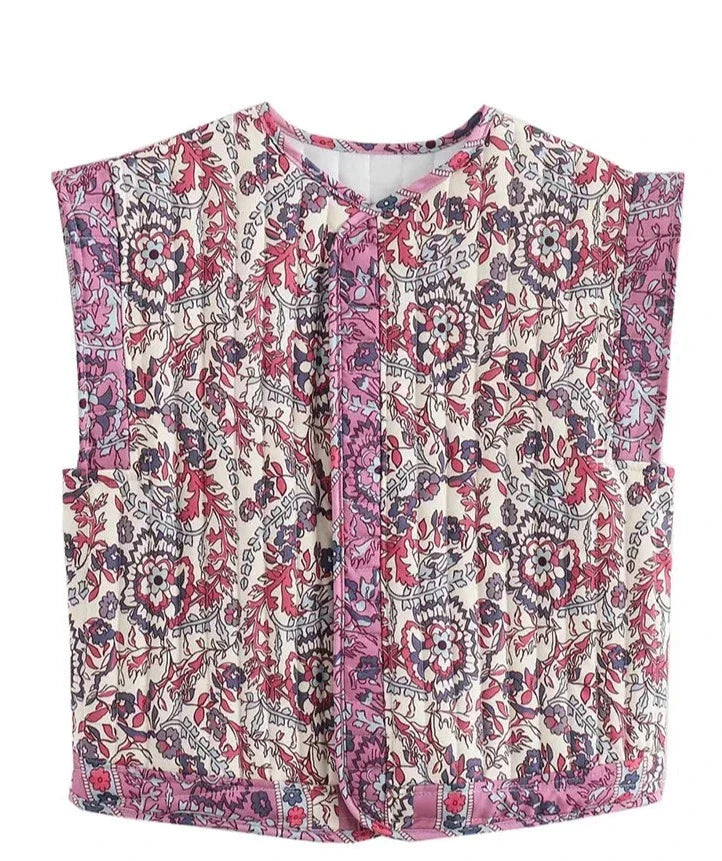 Let quiltet kvindevest uden ærmer, ideel til lag-på-lag-styling, med raffineret design for hverdag og fest.