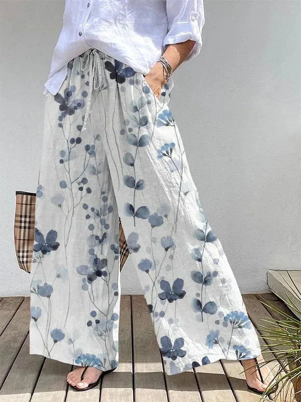 "Løse damebukser med bladmønster, bred pasform og elastisk talje, ideelle til sommerbrug."