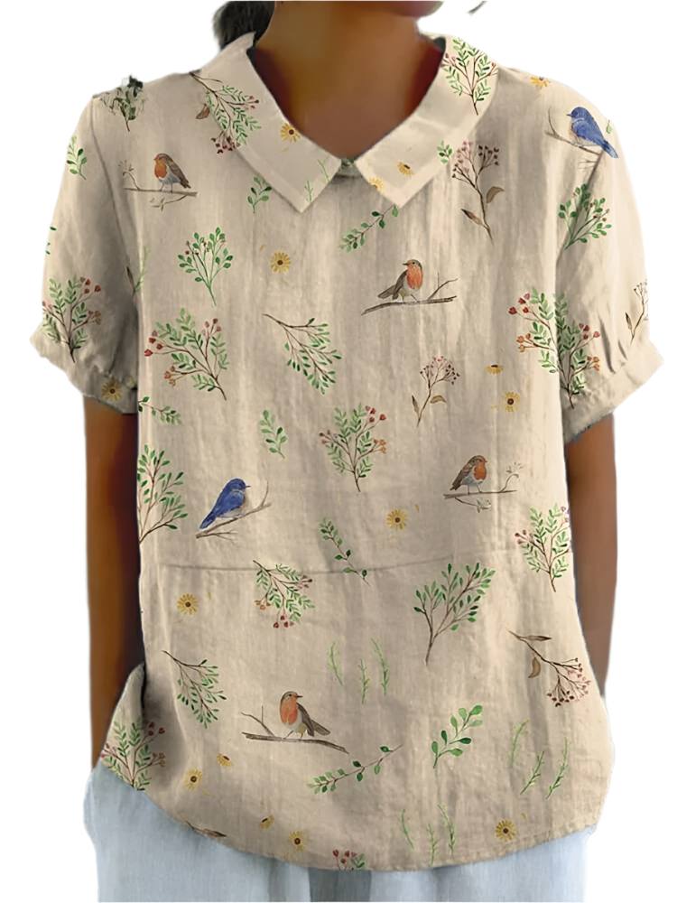 "Luftig damebluse med rødkælk design i let bomuld-hør, naturprint med grene og fugle, sommerlig elegance til kvinder."