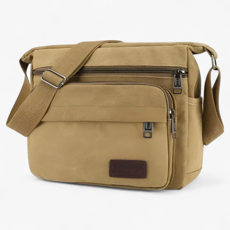 "Multifunktionel canvas skuldertaske til mænd med justerbar rem og rummelige lommer til daglig brug."