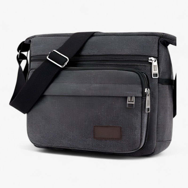 "Multifunktionel canvas skuldertaske til mænd med justerbar rem og rummelige lommer til daglig brug."