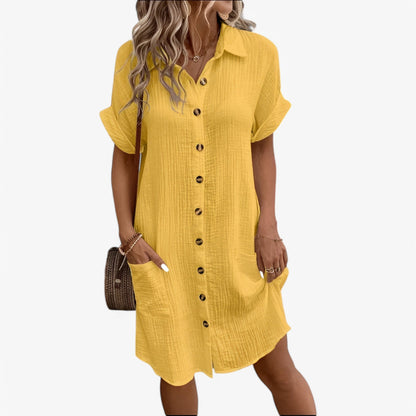 "Olivia langærmet sommerkjole i blødt bomuld, rund hals, knælængde, ideel til sommerens varme dage."