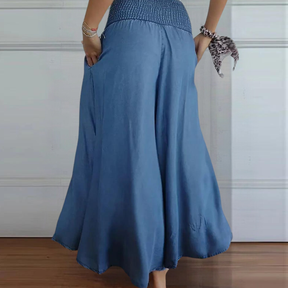 "Perla damebukser med høj talje, brede ben og elastisk linning, blå farve, moderne stil og komfortable design."