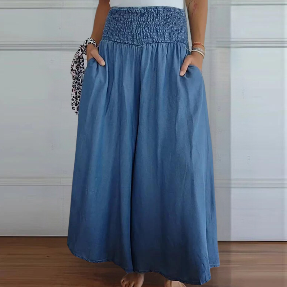 "Perla damebukser med høj talje, brede ben og elastisk linning, blå farve, moderne stil og komfortable design."