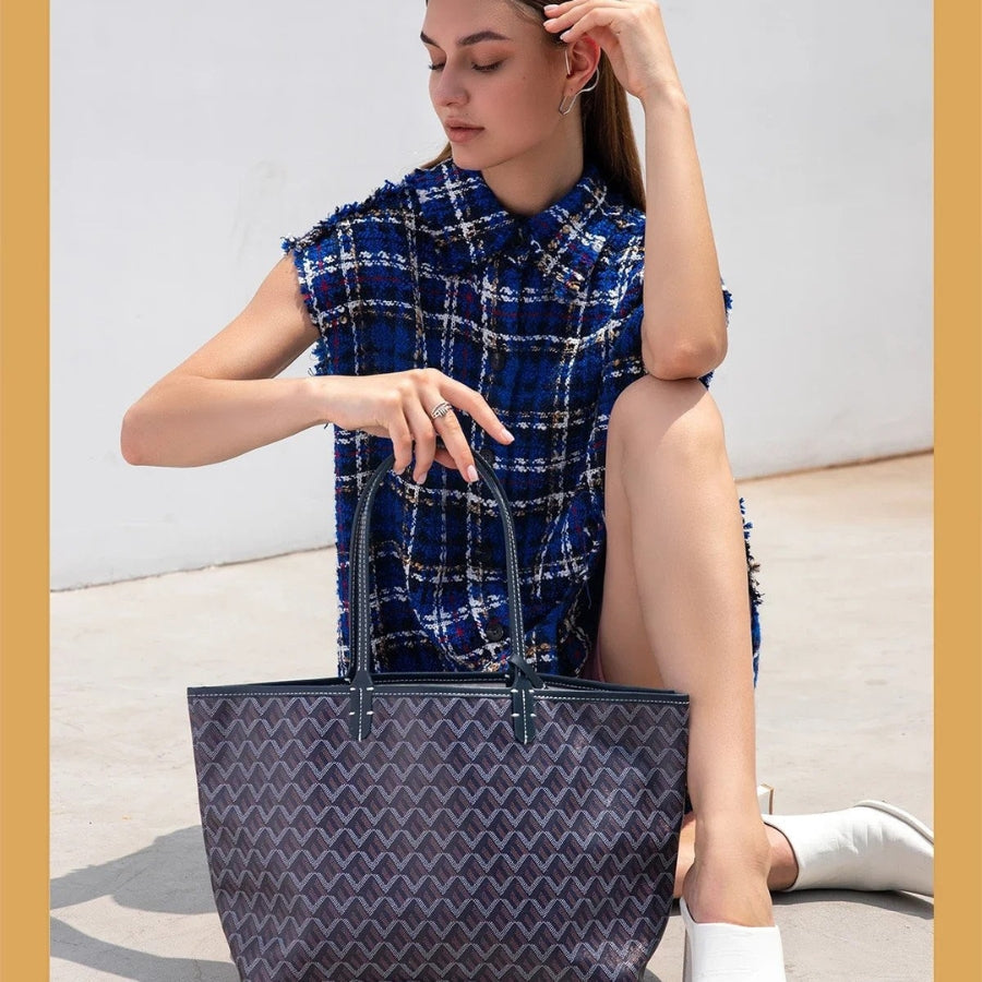 "Rummelig Ainara håndtaske med forstærkede håndtag, elegant brun farve og sofistikeret design, perfekt til hverdagsbrug."