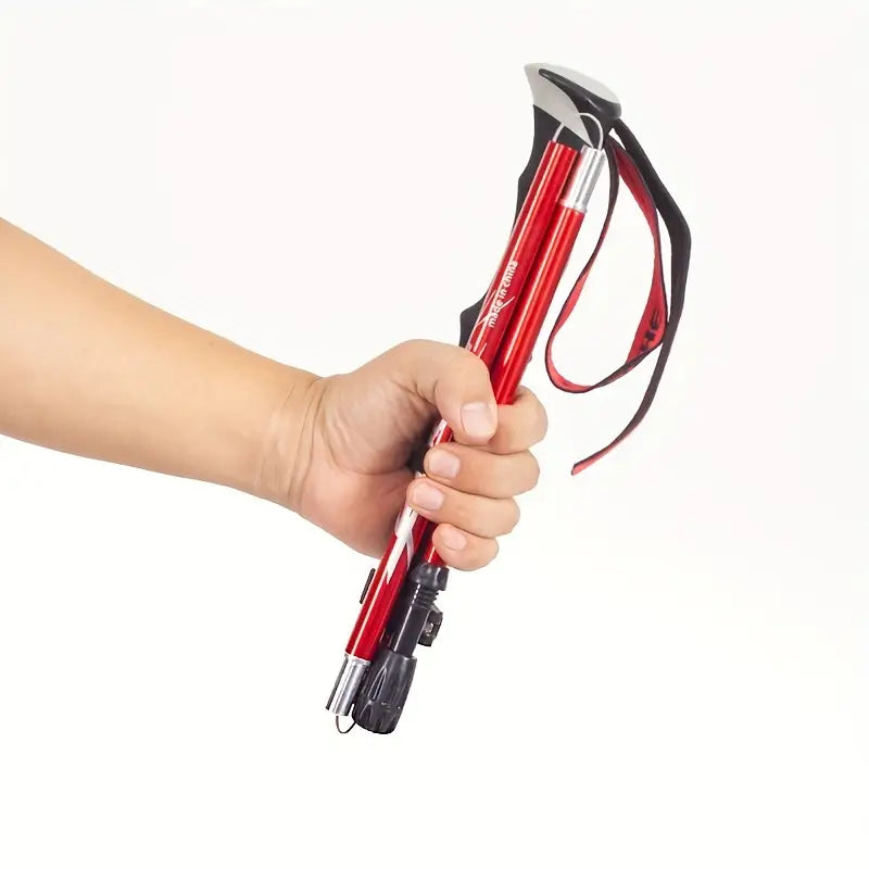 "Sammenklappelig let vandrestok i aluminium, justerbar længde, ideel til alle terræner med praktisk håndledsrem."