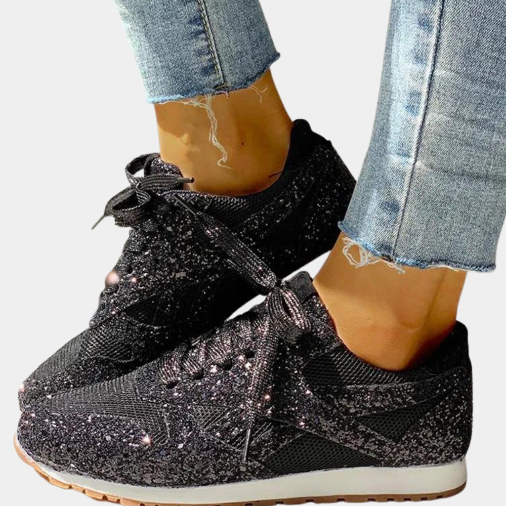 Sort glitrende sportssko til kvinder med pailletter og polstrede såler. Ideelle til træning og sociale begivenheder.