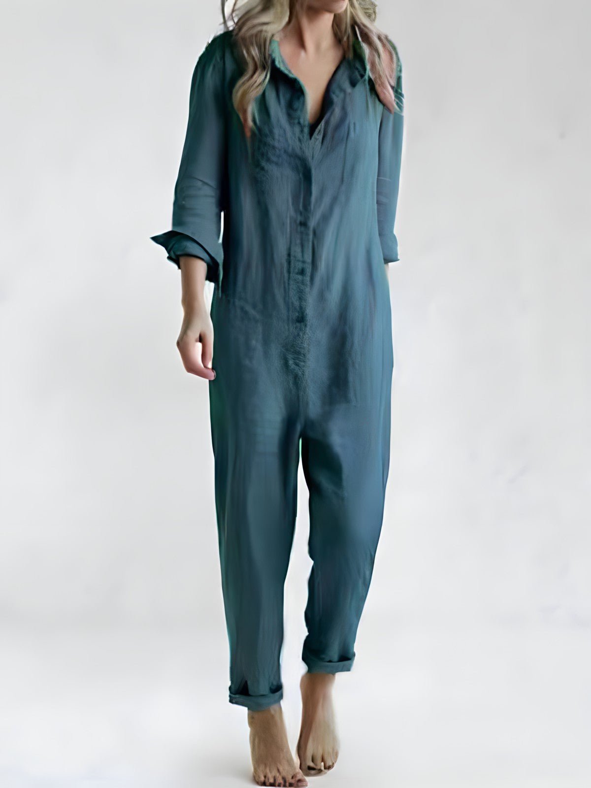 Stilfuld blå og grøn Kaya jumpsuit til kvinder, elegant design med lange ærmer og komfortabel pasform til enhver lejlighed.