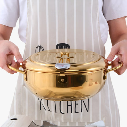 "Stilfuld frituregryde af rustfrit stål med indbygget termometer for præcis madlavning og nem rengøring."