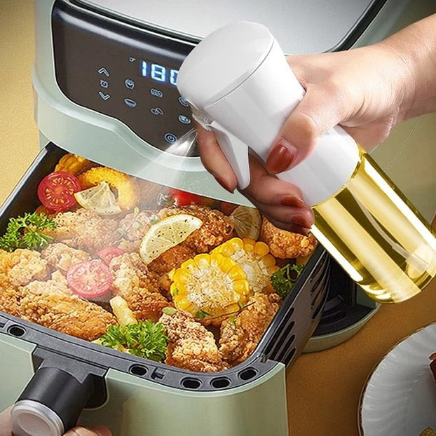 "Stilfuld oliespraydispenser, ergonomisk design, let håndtering, 200 ml kapacitet til præcis oliemængde ved madlavning."